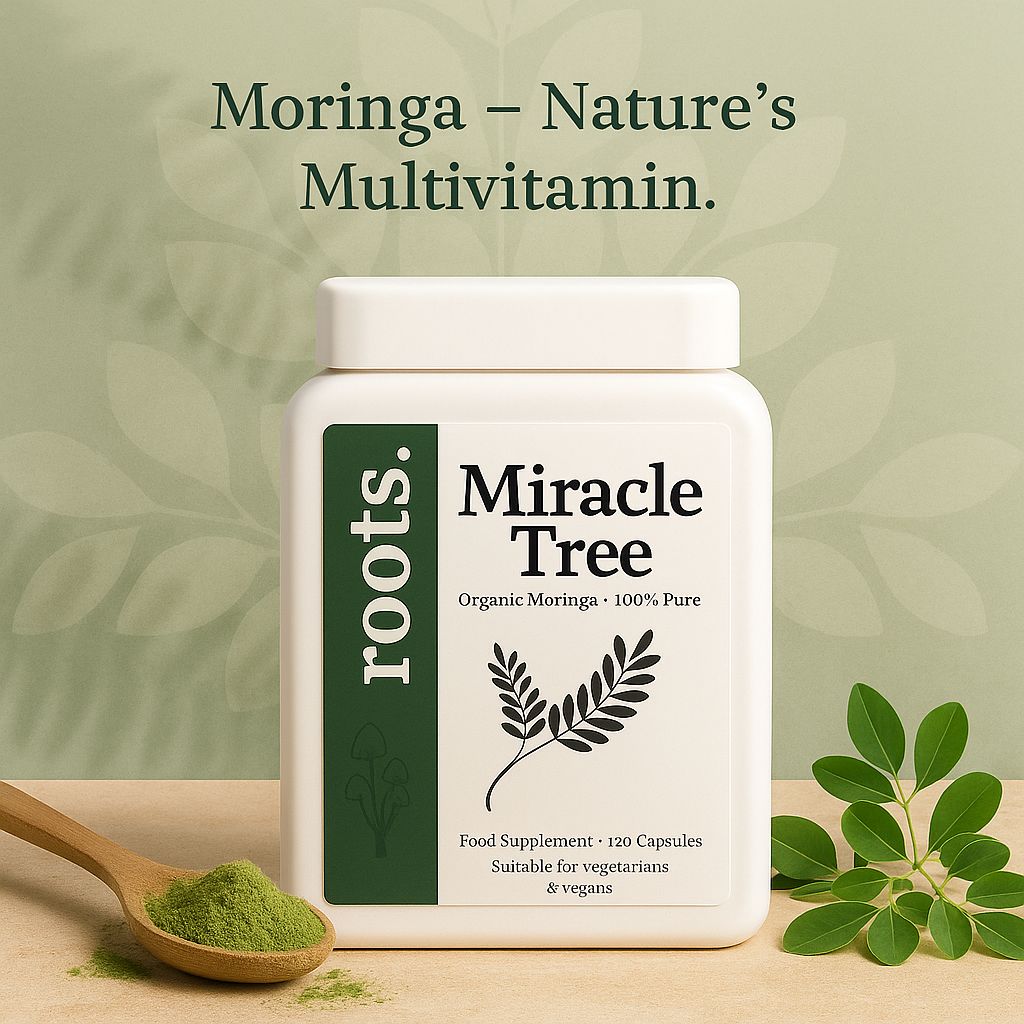 Moringa supplement container labeled 'Miracle Tree' by 'roots.' on a wooden surface with green leaves.